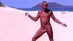 Tanned guy on beach in tiny string thong (temporarily!)