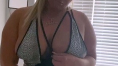 Mature blonde masturbates with sex toy in porn movie